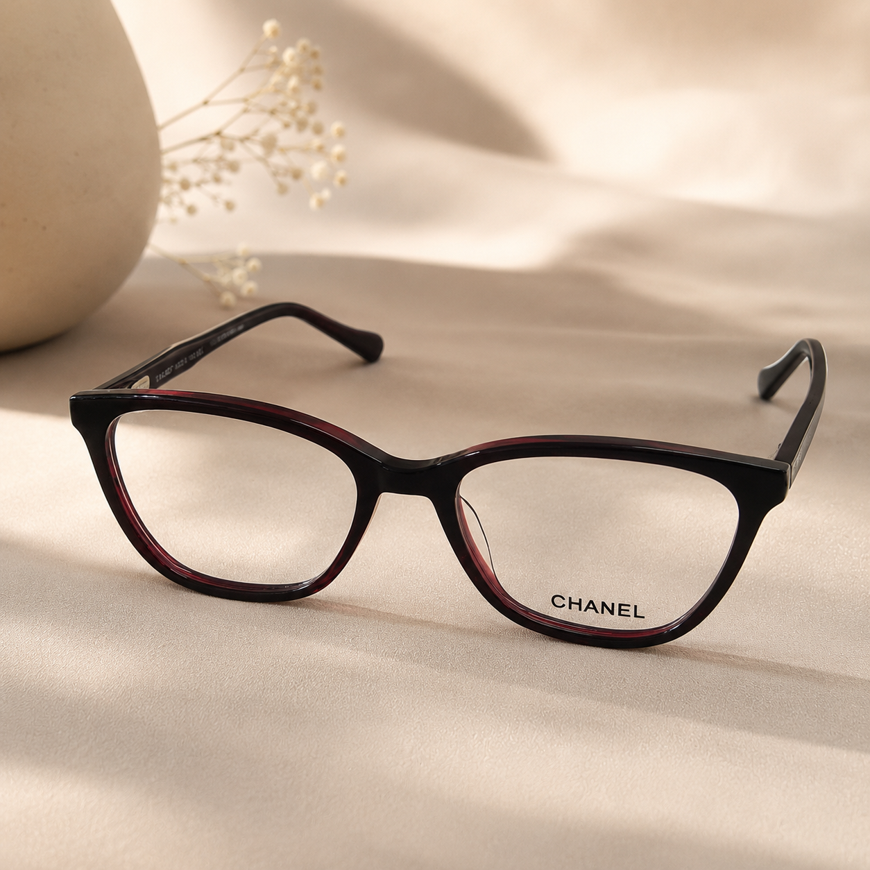 file_0000000070d481fabf4b9d18aa12a359 Premium Cat-Eye Optical Frame – Burgundy & Black for Women - Image 1